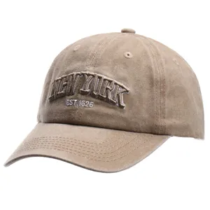 Close-up detail view of the washed cotton baseball cap featuring embroidered New York text.