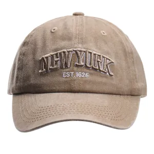 Close-up detail of the washed cotton baseball cap front embroidery, showing fine craft.