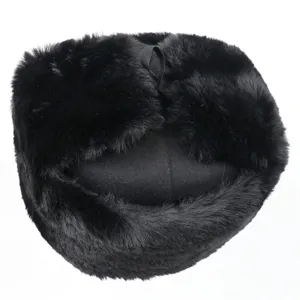Black winter trapper hat with warm faux fur and ear flaps, ideal for outdoor cold weather protection.
