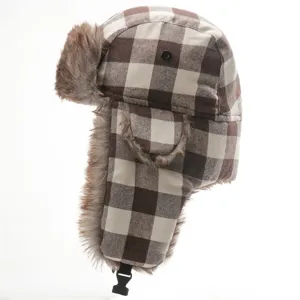 Detail view of brown and white plaid ushanka hat, thick faux fur earflap winter warm design.