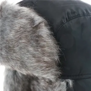 Winter warm trapper hat detail shot, thick windproof cap with soft plush grey earflaps.