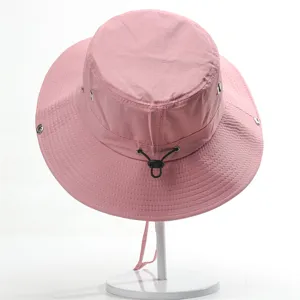 Pink outdoor bucket hat detail, quick-dry fabric, adjustable drawstring and wide brim.
