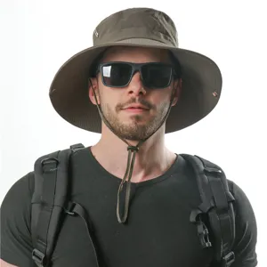 Detail view of outdoor bucket hat wide brim waterproof fabric adjustable windproof chin cord.