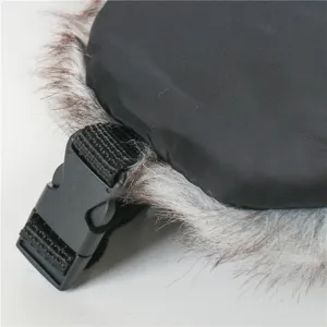 Detail view of winter ushanka hat with warm faux fur trim and secure plastic buckle.