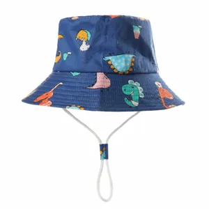 Detailed view of the kids cartoon dinosaur print bucket hat, showing brim and size info.
