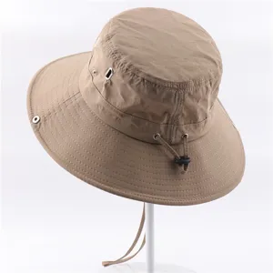 Khaki outdoor sun bucket hat detail, quick-dry fabric, breathable eyelets, adjustable strap.