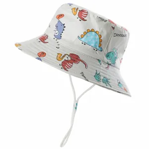 Detailed close-up view of the kids cotton bucket hat featuring cute cartoon dinosaur prints.