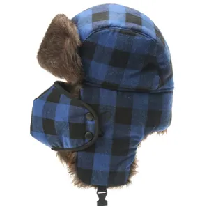 Close-up detail view of the blue and black plaid winter trapper hat with soft faux fur lining.