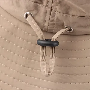 Close-up detail of outdoor bucket hat khaki adjustable drawstring metal eyelet waterproof