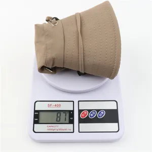 Outdoor sun protection bucket hat detail display showing lightweight portable design and weight.