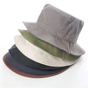 Close-up detail of stacked classic bucket hats in multiple solid colors for daily casual wear.