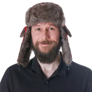 Close-up detail of the warm faux fur trapper hat with red and black plaid ear flaps.