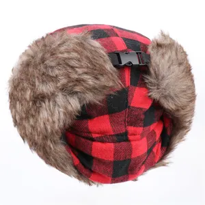 Red and black plaid winter trapper hat with warm faux fur earflaps and adjustable buckle.