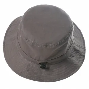 Dark grey bucket hat detail showing adjustable drawstring and breathable fabric design.