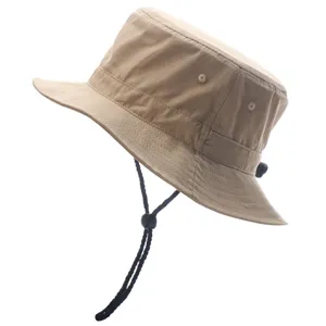 Khaki bucket hat detail showing adjustable black chin strap and breathable side eyelets.