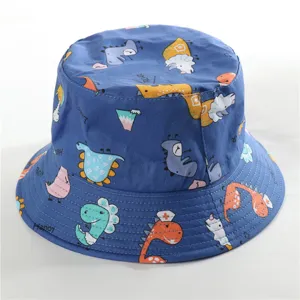 Detailed view of the cute dinosaur print cotton bucket hat, showing fabric texture and pattern.