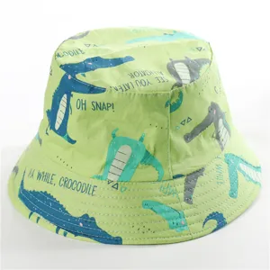 Detail view of the cute cotton kids bucket hat featuring fun cartoon alligator prints and text.