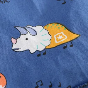 Cute cartoon dinosaur print cotton fabric detail for kids sun hat, breathable and soft.