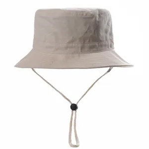 Beige bucket hat with adjustable chin strap, casual sun protection cap for outdoor summer.
