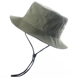 Green outdoor bucket sun hat with chin strap and toggle, lightweight summer sun protection accessory.