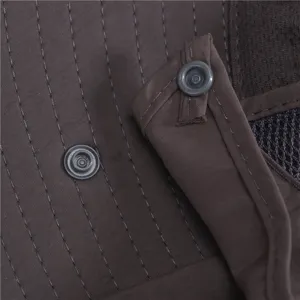 Detailed closeup view of brown outdoor sun hat showing durable waterproof fabric and snap buttons.