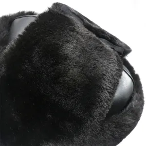 Black winter faux fur bomber hat, warm PU leather ear-flap ushanka for cold weather.
