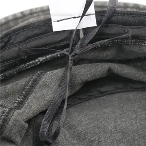 Detailed close-up showing the interior lining, quality stitching, and care label of the hat.