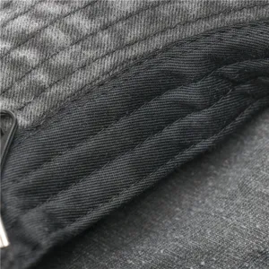 Close-up detail showing fine stitching and washed cotton texture of the retro outdoor bucket hat.