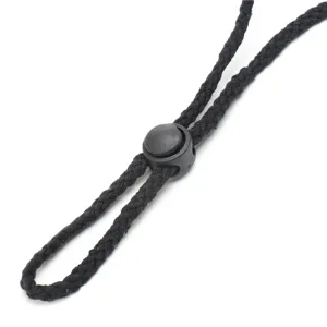 Adjustable black chin cord and plastic cord lock detail for outdoor hats, durable.
