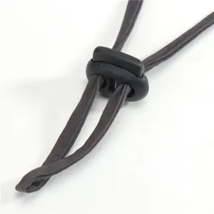 Adjustable drawstring and cord lock detail for outdoor sun hat, durable and reliable use.