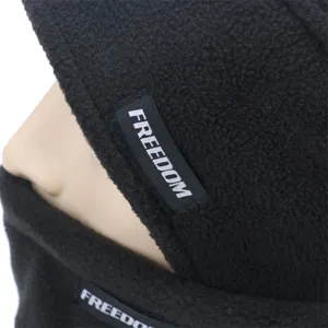 Close-up detail of the black fleece winter windproof hat showing soft thermal fabric and label.