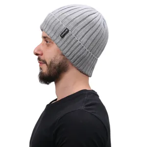 Detail view of the grey ribbed knit beanie hat showcasing side fit and soft texture.