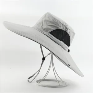 Wide brim sun hat with breathable mesh side panels and adjustable chin strap for outdoor wear.