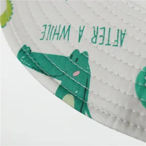 Kids cotton bucket hat detail, cute cartoon crocodile print, sun protection outdoor sun hat.