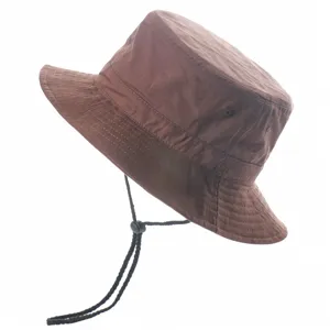 Detail shot of a brown bucket hat with black adjustable chin strap, ideal for sunny outdoor days.