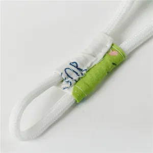 Detailed view of kids sun hat drawstring with cartoon crocodile print and cotton material.
