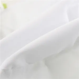 White cotton fabric detail of kids sun hat, breathable woven texture close-up.