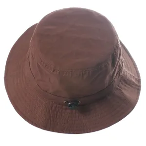 Brown bucket hat detail showing adjustable cord and neat stitching texture for outdoor sun.