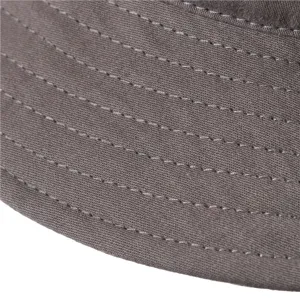 Detailed view of the dark grey cotton bucket hat brim featuring neat parallel stitching lines