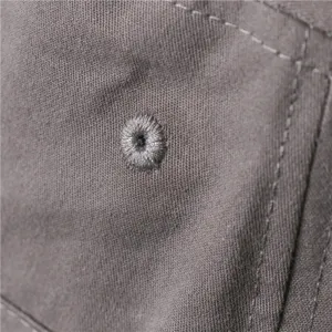 Detailed close-up of a stylish bucket hat showing premium fabric texture and stitching.