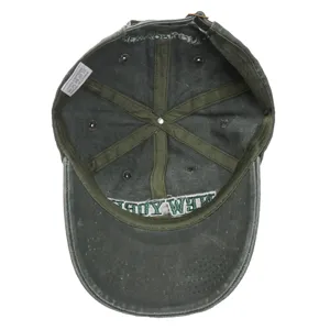 Detailed view of the inside of a dark green washed cotton baseball cap with interior seams.