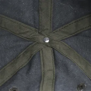 Baseball cap inner detail view showing washed cotton fabric and stitch workmanship.