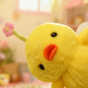 Cute yellow chick plush toy with pink flower detail, soft stuffed animal doll for kids gift.