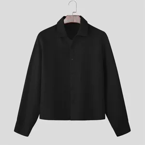 Detailed view of the black textured long-sleeve shirt collar and button craftsmanship.