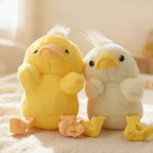 Cute little yellow and white chick plush toys close up detail, soft stuffed animal dolls.