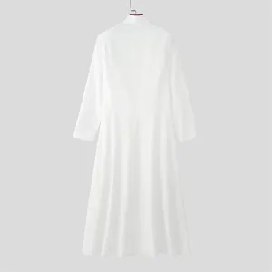 Detailed view of the back of a white long men's blazer with a stand collar and flared hem.