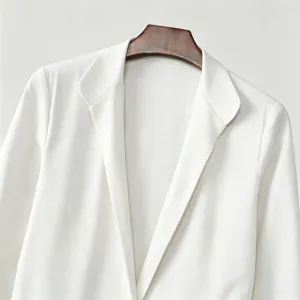 White blazer coat detail shot, professional lapel design, elegant style for men or women.