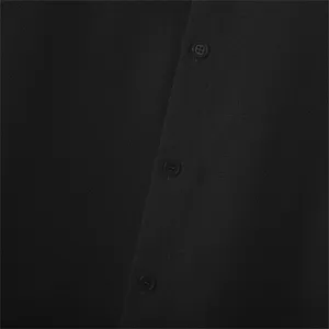 Detail view of men's black textured shirt button placket, minimalist casual daily wear.