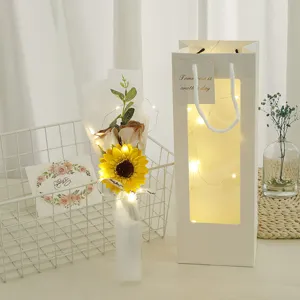 Detailed view of the romantic sunflower dried flower bouquet gift bag set with warm fairy lights.