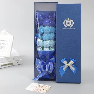 Blue soap rose bouquet detail view with gift box and ribbon decoration for romantic occasions.
